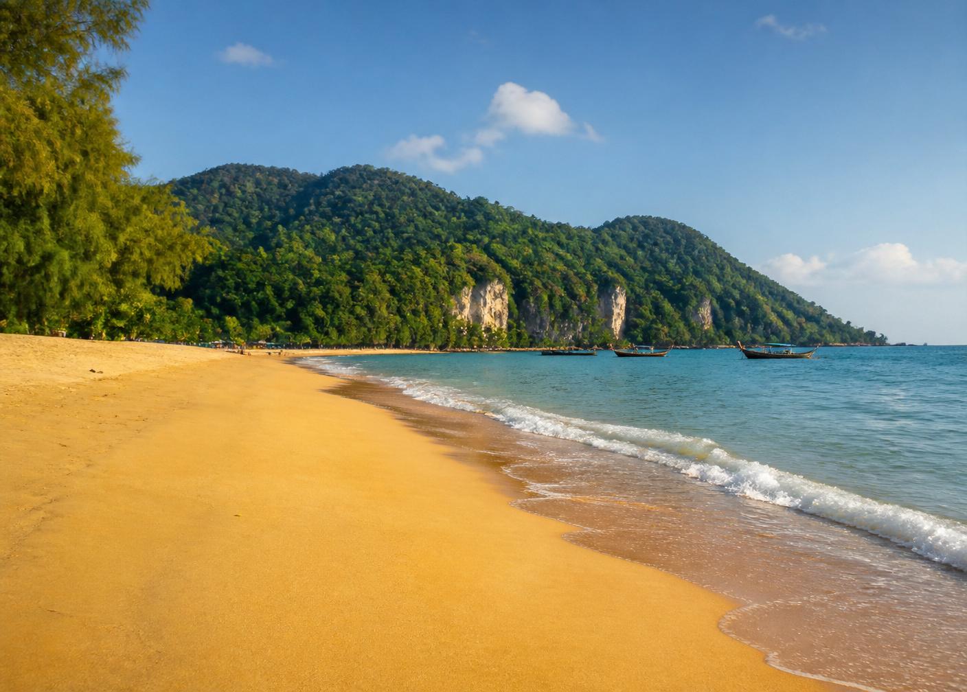 Palm trees and turquoise sea in Khao Lak, Thailand
